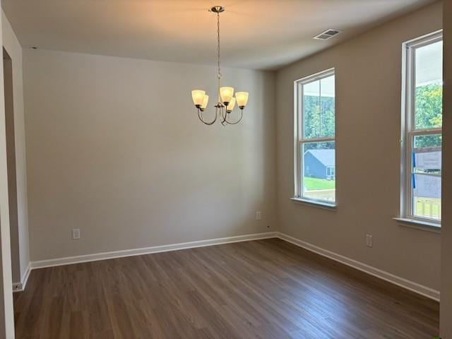 30 Riverrock Trl, Dallas, GA 30157 - unfurnished room with dark wood-style flooring and a chandelier