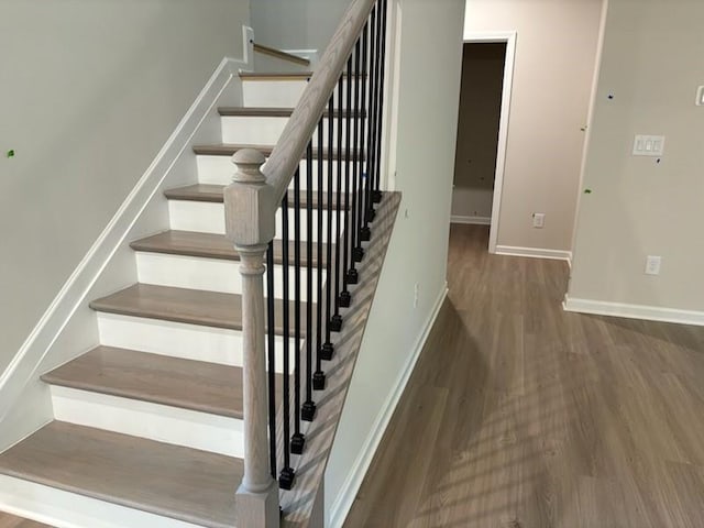 30 Riverrock Trl, Dallas, GA 30157 - staircase with wood finished floors and baseboards