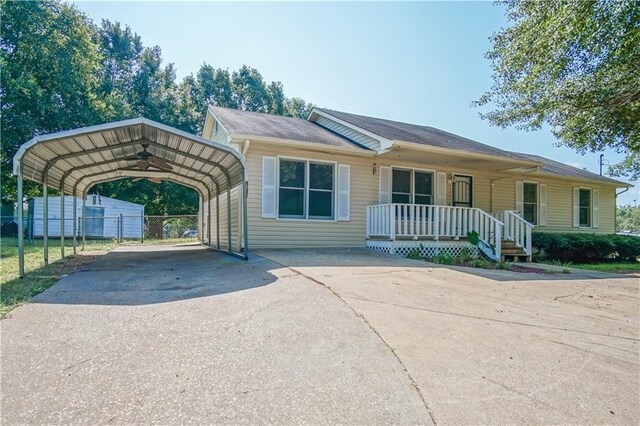 ranch-style house featuring a carport