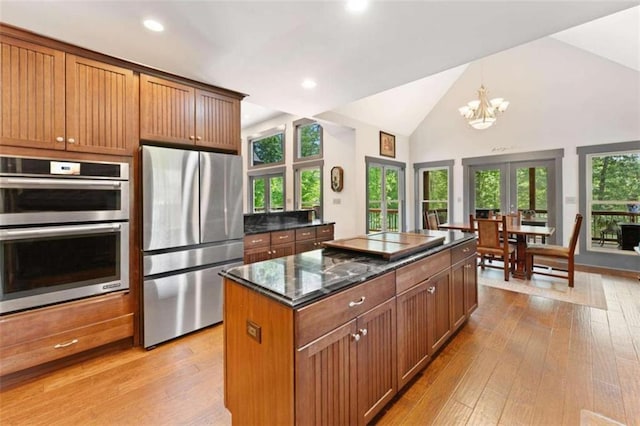 274 Ramey Rd, Westminster, SC 29693 - kitchen featuring stainless steel appliances, light wood-type flooring, a center island, vaulted ceiling, and a chandelier