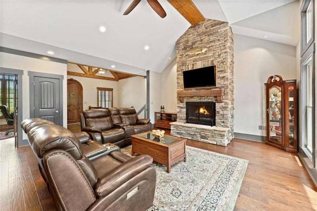 274 Ramey Rd, Westminster, SC 29693 - living room featuring a ceiling fan, beam ceiling, wood finished floors, a stone fireplace, and high vaulted ceiling