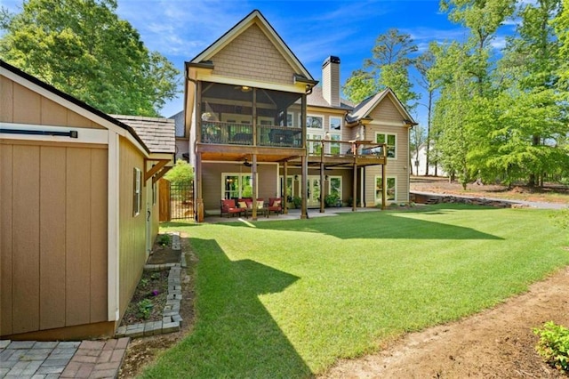 274 Ramey Rd, Westminster, SC 29693 - rear view of house featuring a sunroom, a chimney, ceiling fan, a patio, and a wooden deck