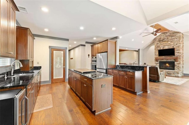 274 Ramey Rd, Westminster, SC 29693 - kitchen featuring appliances with stainless steel finishes, a center island, a ceiling fan, open floor plan, and wood finished floors