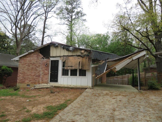 exterior space featuring a carport