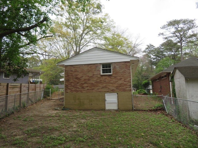 back of property with a lawn