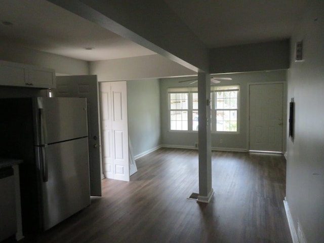 kitchen with stainless steel appliances, white cabinetry, dark wood-type flooring, and ceiling fan