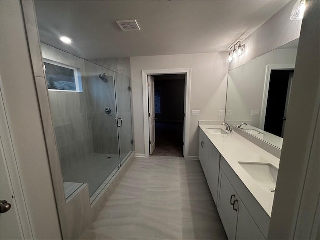 bathroom with an enclosed shower and vanity