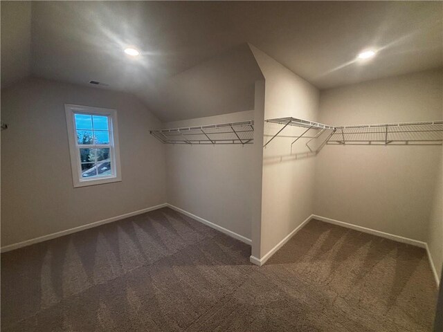 unfurnished bedroom featuring dark carpet