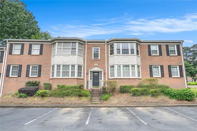 2349 Henderson Mill Rd NE Unit 2, Atlanta, GA 30345 - townhome / multi-family property featuring uncovered parking and brick siding