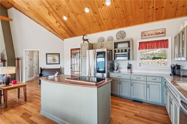 kitchen with a center island, wooden ceiling, stainless steel appliances, and light wood-type flooring