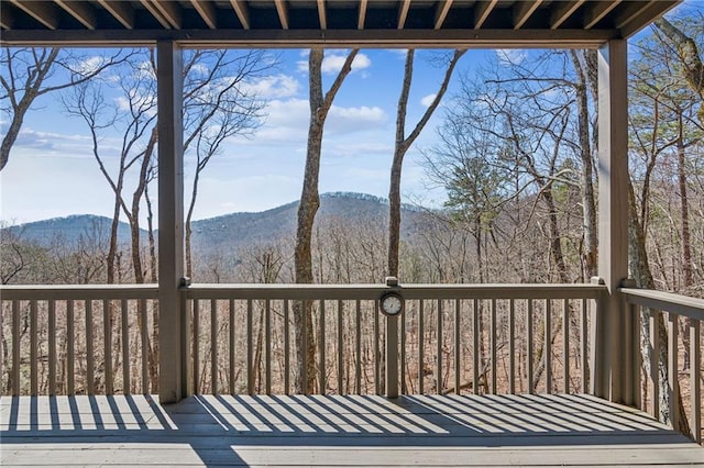 wooden deck with a mountain view