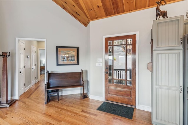 foyer with baseboards, light wood-style flooring, wood ceiling, and lofted ceiling