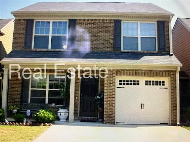 view of front of home with concrete driveway, brick siding, and an attached garage