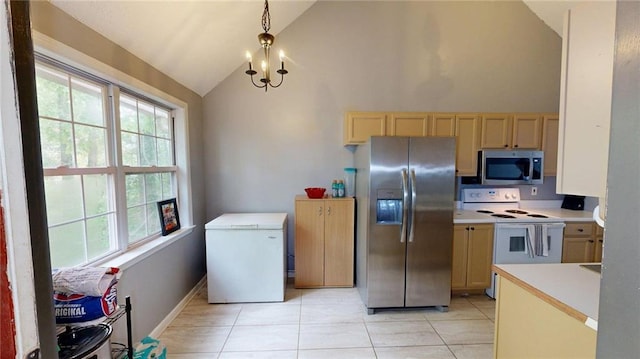 kitchen featuring appliances with stainless steel finishes, light countertops, light tile patterned floors, high vaulted ceiling, and light brown cabinets
