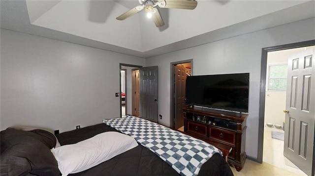 bedroom featuring ceiling fan and ensuite bath