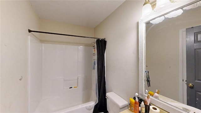 bathroom featuring shower / bathtub combination with curtain and toilet