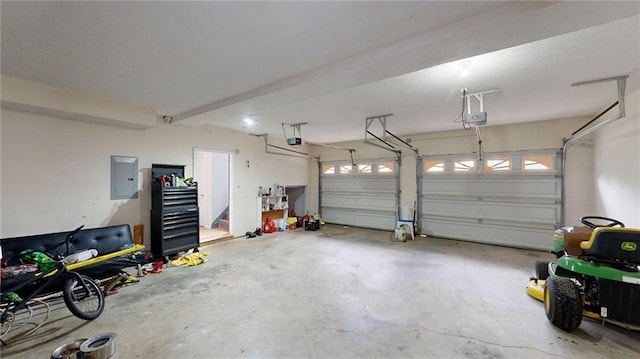 garage featuring a garage door opener and electric panel