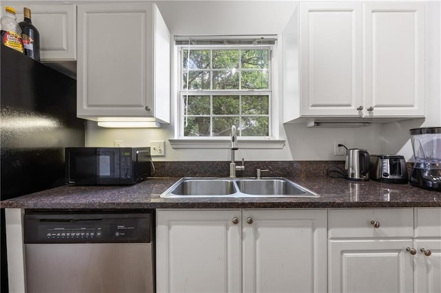 kitchen with stainless steel dishwasher, sink, and white cabinetry