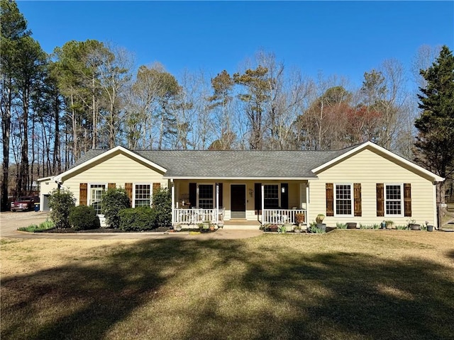 ranch-style house featuring a porch and a front lawn