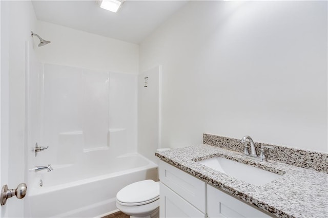 bathroom featuring toilet, tub / shower combination, and vanity