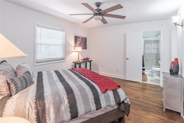 bedroom featuring ensuite bath, baseboards, a ceiling fan, and wood finished floors