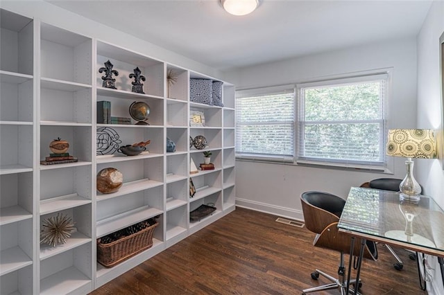home office featuring visible vents, baseboards, and wood finished floors