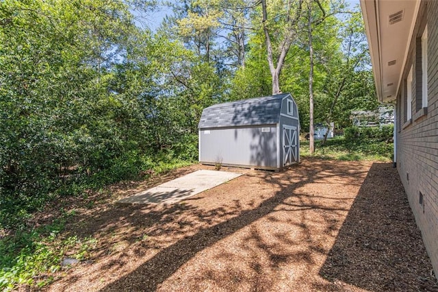 exterior space with an outbuilding and a storage unit