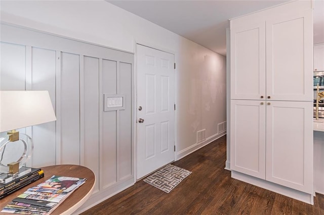 entrance foyer featuring dark wood-type flooring