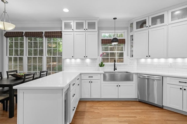 1241 Newbridge Trce, Brookhaven, GA 30319 - kitchen with dishwasher, a peninsula, crown molding, backsplash, and white cabinetry