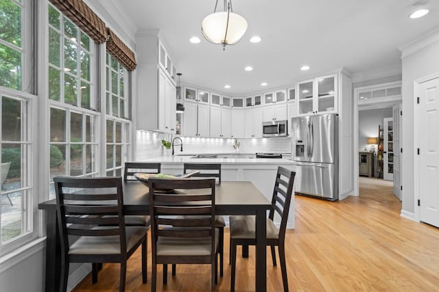 1241 Newbridge Trce, Brookhaven, GA 30319 - dining room featuring ornamental molding, healthy amount of natural light, light wood finished floors, and recessed lighting