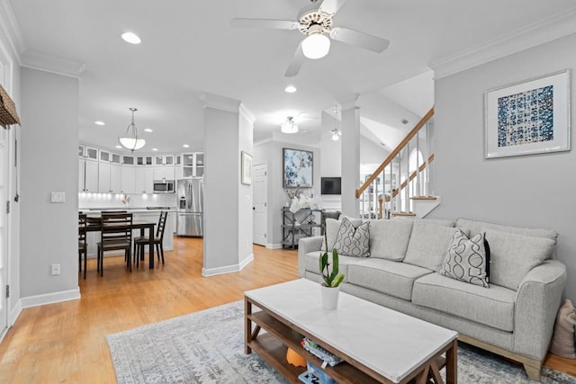 1241 Newbridge Trce, Brookhaven, GA 30319 - living room featuring ornamental molding, stairway, a ceiling fan, recessed lighting, and light wood-style flooring
