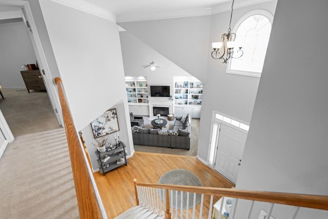 1241 Newbridge Trce, Brookhaven, GA 30319 - entryway with ceiling fan, high vaulted ceiling, ornamental molding, a fireplace, and a chandelier