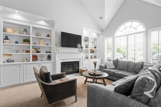 1241 Newbridge Trce, Brookhaven, GA 30319 - living area with a high end fireplace, plenty of natural light, built in features, and high vaulted ceiling