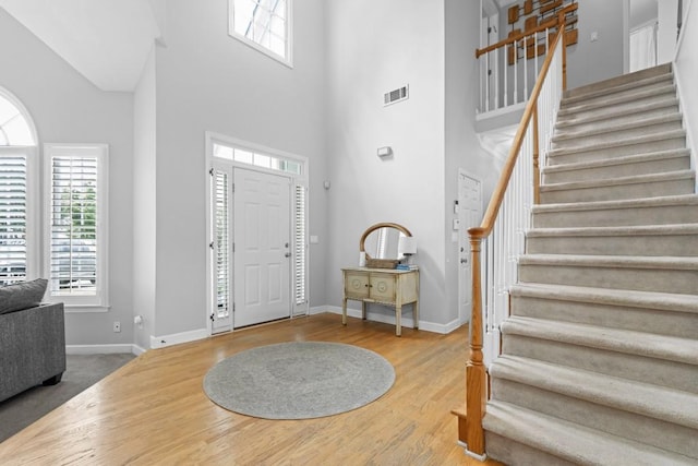 1241 Newbridge Trce, Brookhaven, GA 30319 - foyer featuring a high ceiling, stairway, and wood finished floors