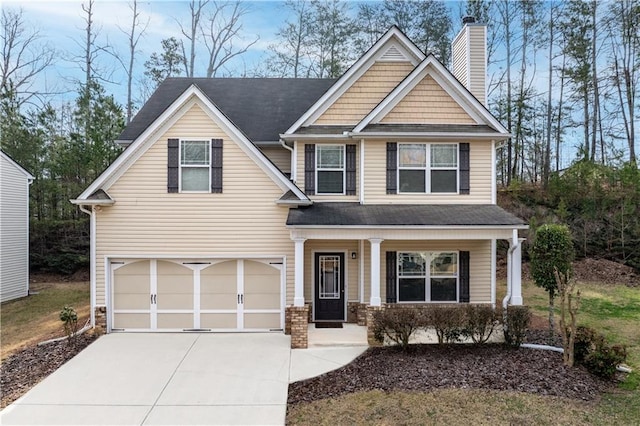 craftsman-style home with concrete driveway, covered porch, a chimney, stone siding, and an attached garage