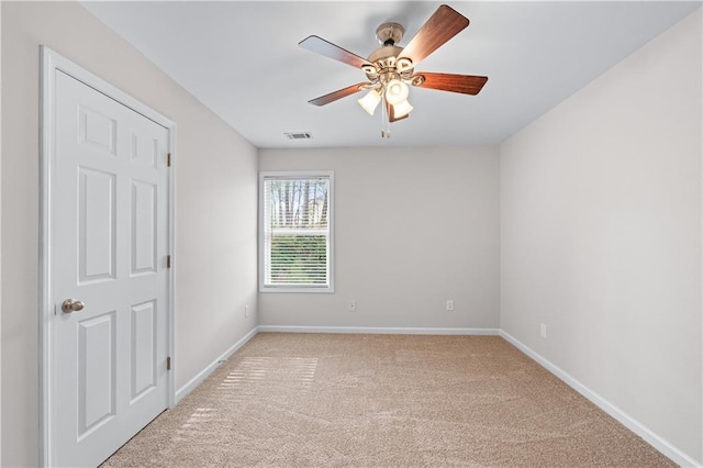 1558 Autumn Wood Trl, Sugar Hill, GA 30518 - spare room with ceiling fan, light carpet, visible vents, and baseboards