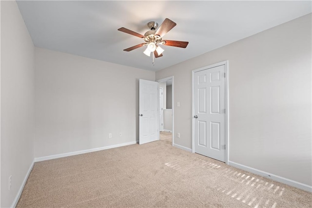 1558 Autumn Wood Trl, Sugar Hill, GA 30518 - unfurnished bedroom featuring a ceiling fan, baseboards, and light colored carpet
