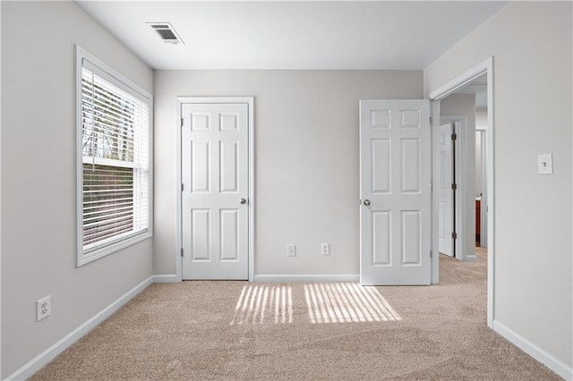 1558 Autumn Wood Trl, Sugar Hill, GA 30518 - unfurnished bedroom with visible vents, baseboards, and carpet floors