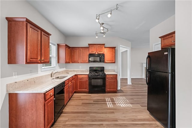 1558 Autumn Wood Trl, Sugar Hill, GA 30518 - kitchen featuring brown cabinetry, black appliances, a sink, and light wood-type flooring