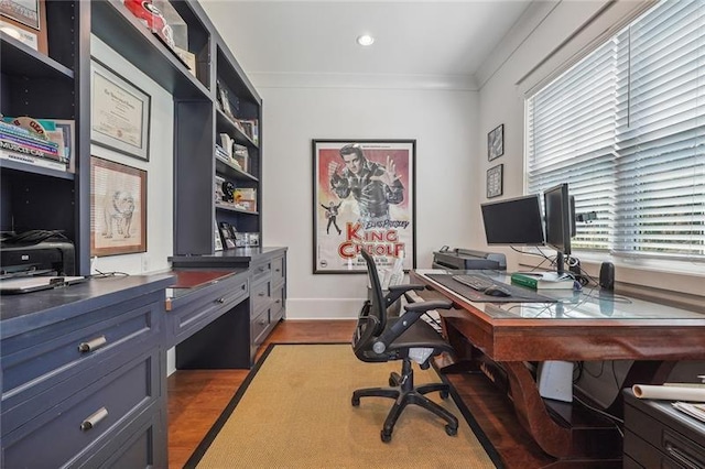 office space with crown molding, light hardwood / wood-style flooring, and a wealth of natural light