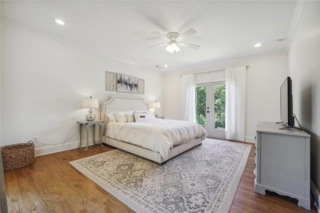 bedroom featuring dark hardwood / wood-style floors, access to exterior, ceiling fan, and french doors