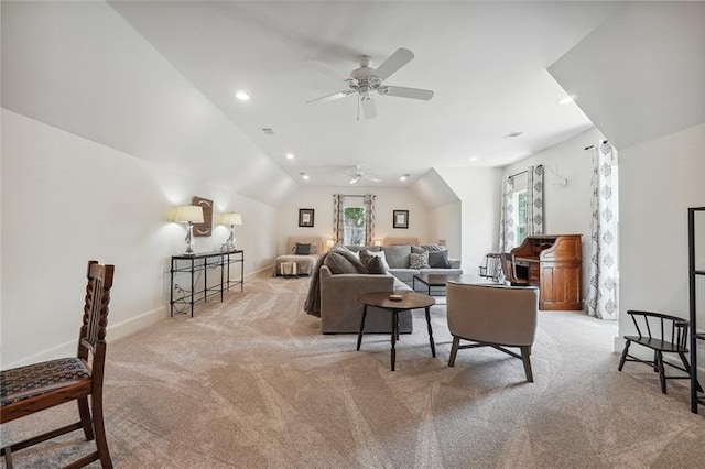 carpeted living room with ceiling fan and lofted ceiling