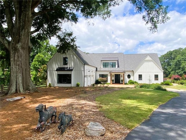 modern inspired farmhouse with a front yard