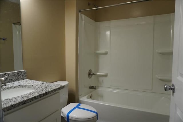 full bath featuring tub / shower combination, vanity, and toilet