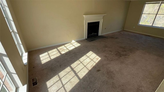 unfurnished living room with carpet floors