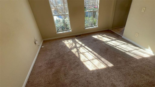 unfurnished room with light carpet