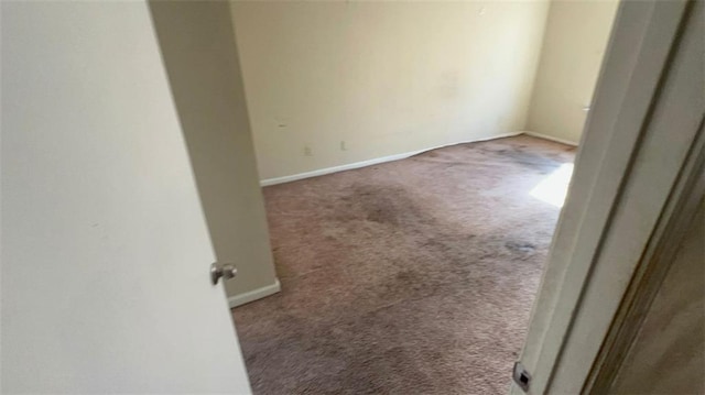 spare room with light carpet