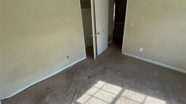 unfurnished bedroom with carpet floors