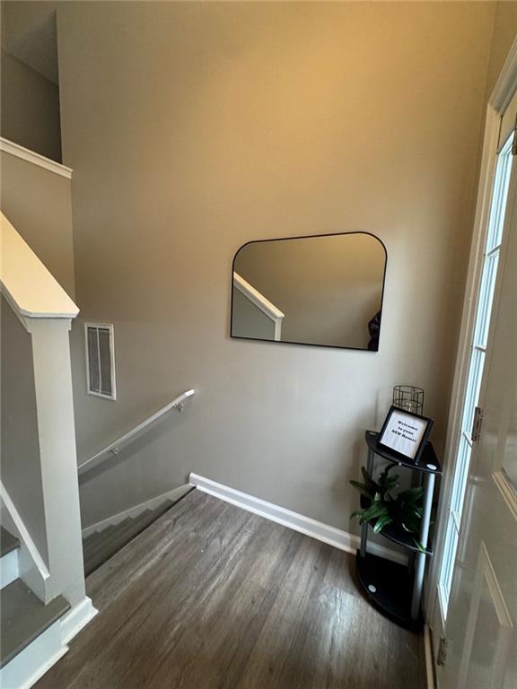 stairway featuring hardwood / wood-style flooring