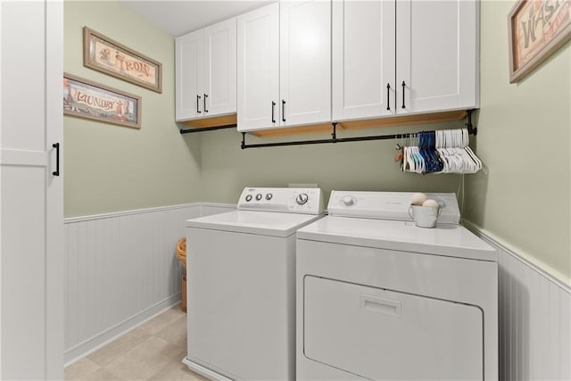 6021 Harbour Mist Dr, Flowery Branch, GA 30542 - laundry room with cabinet space, washer and clothes dryer, and a wainscoted wall